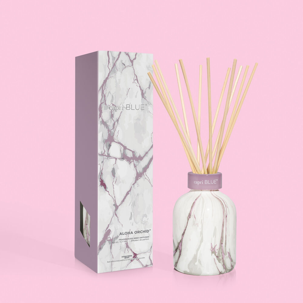 Capri Blue's Aloha Orchid Modern Marble Petite Reed Diffuser, 5.7 fl oz. Amethyst design topped with etched glass collar.