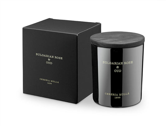 Bulgarian Rose & Oud 8oz Boutique Candle by Cereria Mollá.  The Fragrance: A sweet floral aroma. Dark, rich, and velvety Damascus rose wrapped in smoked oud wood.