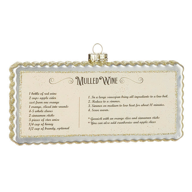 6" Holiday Recipe Ornaments. White with Gold Glitter. Mulled Wine Recipe. Rectangular Shape with Scalloped Edges. 6"L x 3.5"H x 1"W. Made of Glass