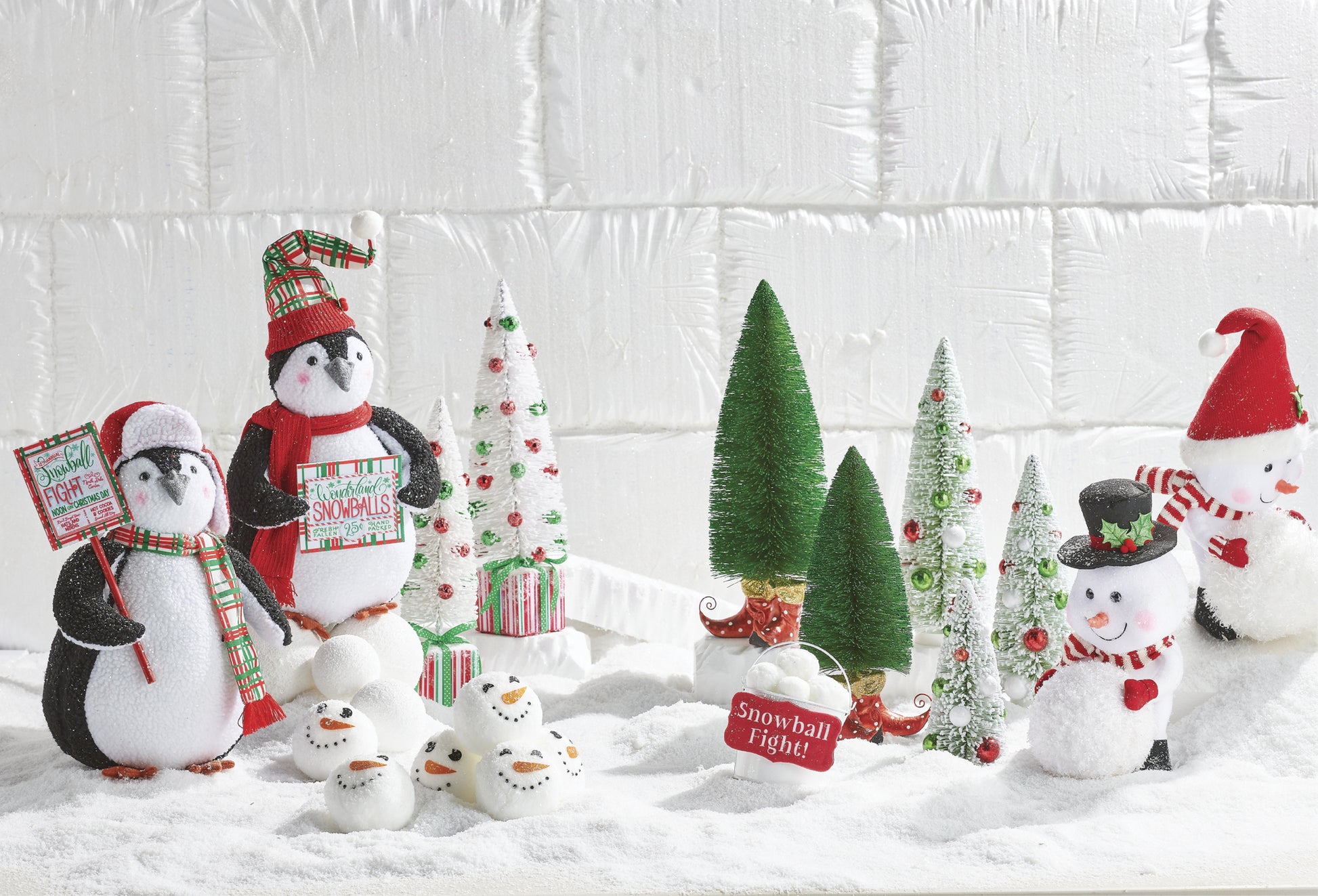 6.5" Snowball Fight Bucket Ornaments set in faux snow, surrounded by plush penguins and mini Christmas trees. So cute and enticing some holiday fun! Red and White. North Pole Friends Theme.